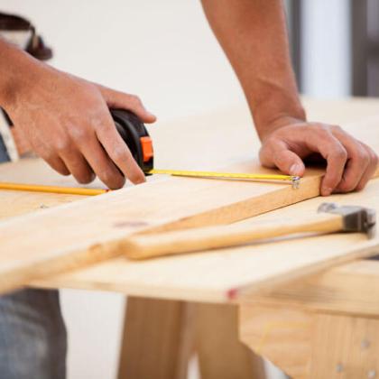 Carpenter in Richmond Measuring a plank